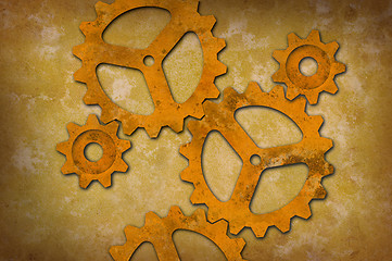 Image showing Rusty gears against a mottled yellowish background