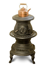 Image showing Antique iron wood-burning stove with copper kettle