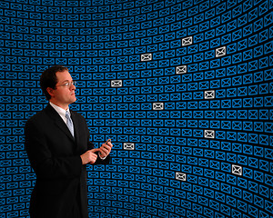 Image showing Man monitoring an array of email icons