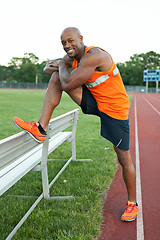 Image showing Track Runner Stretching