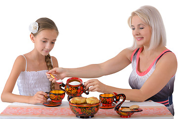 Image showing Mother and daughter drinking tea