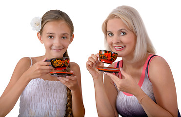 Image showing Mother and daughter drinking tea