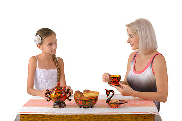 Image showing Mother and daughter drinking tea