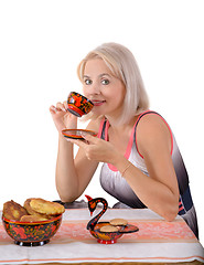 Image showing The blonde drinks tea