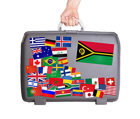 Image showing Used plastic suitcase with stickers