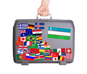 Image showing Used plastic suitcase with stickers