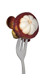 Image showing Mangosteen held by a fork