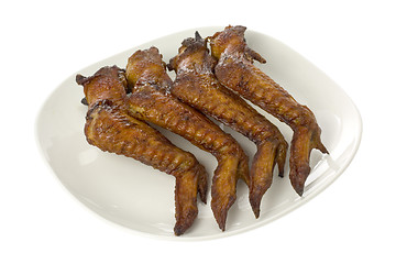 Image showing Plate of BBQ chicken wings

