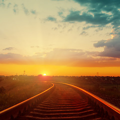 Image showing good orange sunset over railroad to horizon