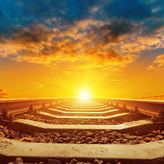 Image showing beautiful orange sunset over railroad close up