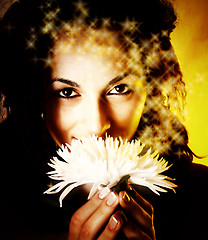 Image showing Girl with a white flower