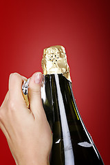 Image showing Opening champagne bottle