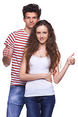 Image showing Young casual couple giving thumbs up