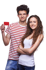 Image showing Young casual couple showing credit card