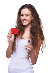 Image showing Playful woman showing blank credit card