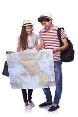 Image showing Couple of tourists looking destination on the map