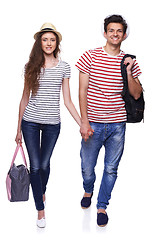 Image showing Young couple walking with travel bags