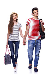 Image showing Young couple walking with travel bags