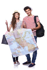 Image showing Couple of tourists holding map