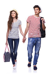 Image showing Young couple walking with travel bags