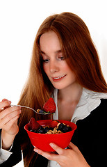 Image showing Woman eating breakfast.