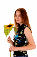 Image showing Pretty girl with sunflower.