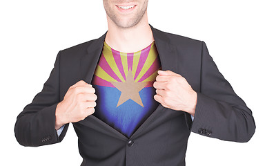 Image showing Businessman opening suit to reveal shirt with state flag