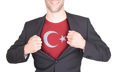 Image showing Businessman opening suit to reveal shirt with flag