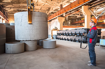 Image showing Worker moving prepared unit to warehouse