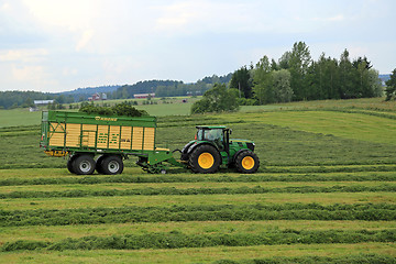 Image showing John Deere 6210R Tractor and Full Krone MX 350 GL Forage Wagon