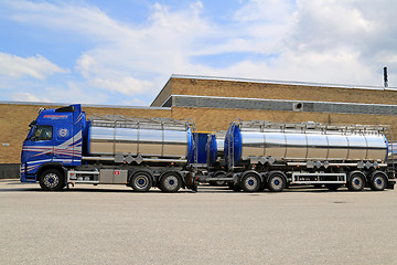 Image showing Volvo Tanker Truck Parked outside Warehouse Building