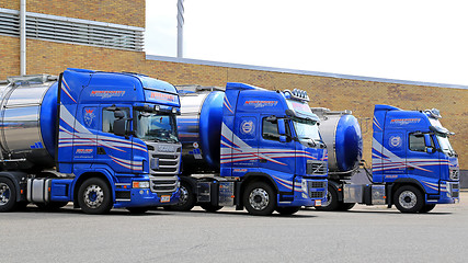 Image showing Fleet of Blue Tanker Trucks on a Yard