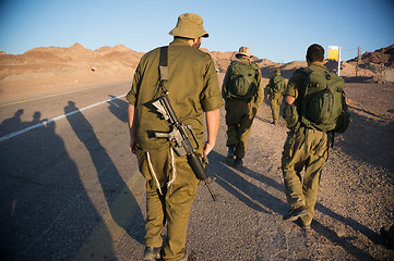 Image showing Soldiers patrol in desert