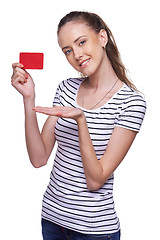 Image showing Happy smiling female showing blank credit card