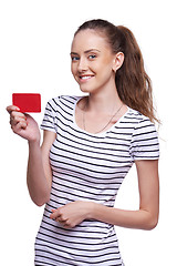 Image showing Happy smiling female showing blank credit card