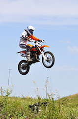 Image showing Motorcyclists on motorcycles participate in cross-country race.