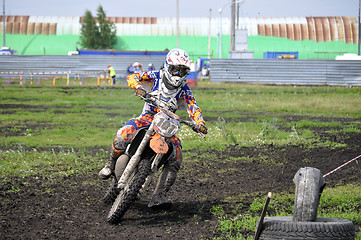 Image showing Motorcyclists on motorcycles participate in cross-country race.