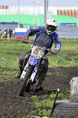 Image showing Motorcyclists on motorcycles participate in cross-country race.