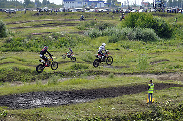 Image showing Motorcyclists on motorcycles participate in cross-country race.