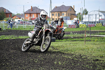 Image showing Motorcyclists on motorcycles participate in cross-country race.