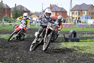 Image showing Motorcyclists on motorcycles participate in cross-country race.