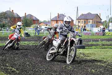 Image showing Motorcyclists on motorcycles participate in cross-country race.