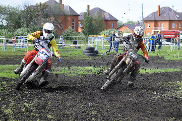 Image showing Motorcyclists on motorcycles participate in cross-country race.