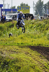 Image showing Motorcyclists on motorcycles participate in cross-country race.