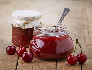 Image showing two jars of fruit jam with cherries