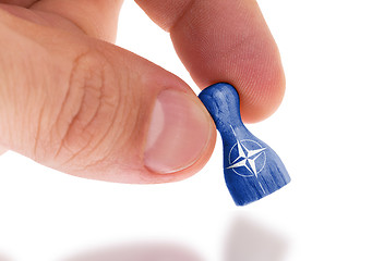 Image showing Wooden pawn with a flag painting