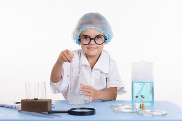 Image showing Chemist girl in chemistry class