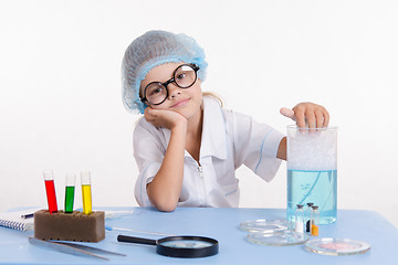 Image showing Girl chemist bored in the classroom