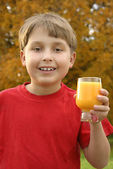 Image showing Boy with a juice