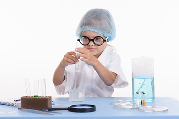 Image showing Girl chemist gets a new formula of chemical compound